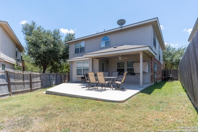 3802 Blue Oak Pass, San Antonio, TX 78223 - back of house featuring ceiling fan, a lawn, brick siding, a fenced backyard, and a patio