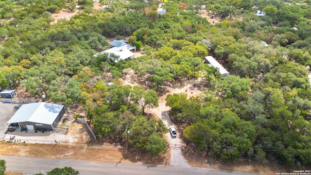 bird's eye view featuring a forest view