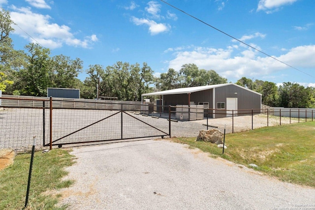 exterior space with an exterior structure, an outdoor structure, and a detached garage