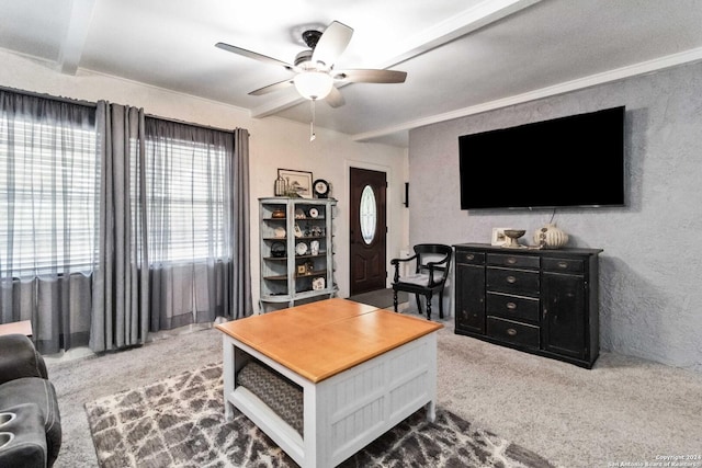 carpeted living area with ceiling fan