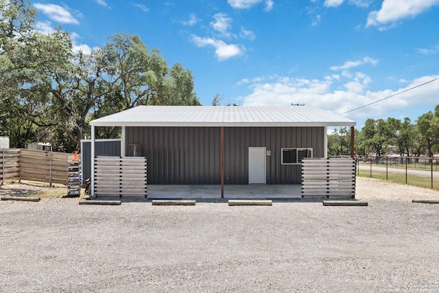 view of outbuilding with an exterior structure and an outbuilding