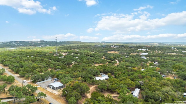aerial view featuring a view of trees