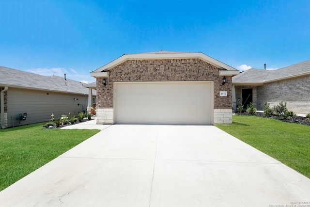 single story home with a front lawn and a garage