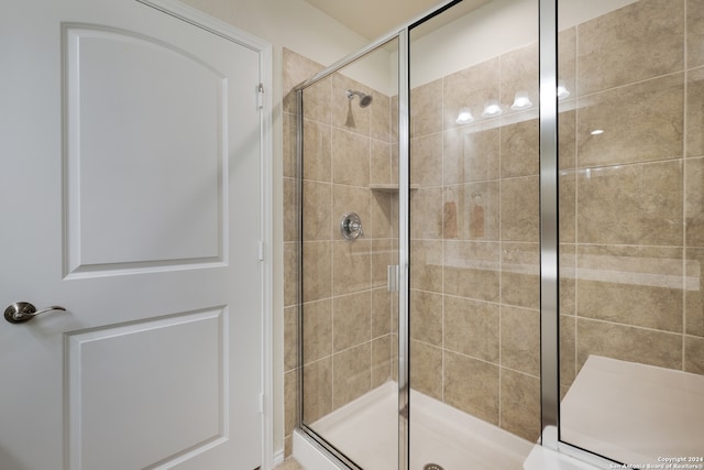 bathroom with walk in shower and toilet