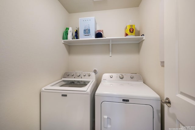 laundry room featuring washer and dryer and laundry area