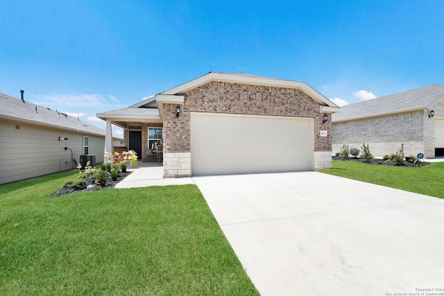 view of front of home with a garage and a front lawn