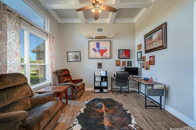 office with hardwood / wood-style floors, ornamental molding, beamed ceiling, coffered ceiling, and ceiling fan