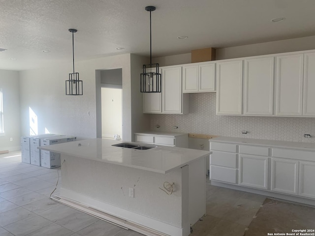 kitchen featuring white cabinetry and a center island