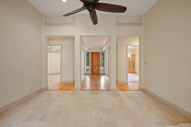 unfurnished room with light hardwood / wood-style flooring and ceiling fan