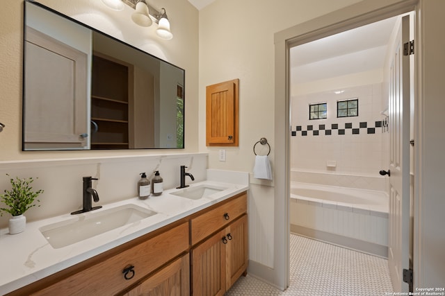 bathroom with double vanity and tile patterned floors