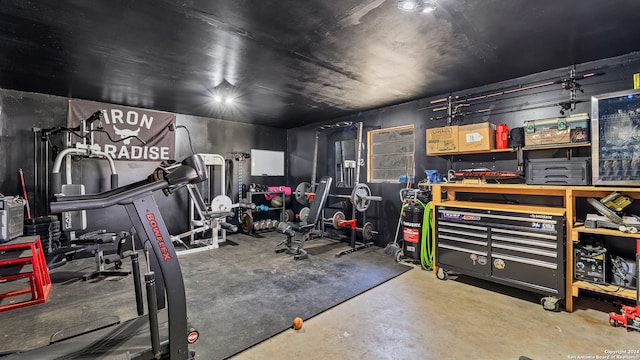 exercise room with concrete floors