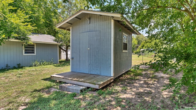 view of outdoor structure with a lawn