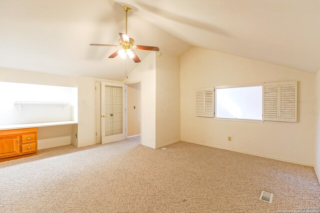 living room with carpet flooring and a high ceiling