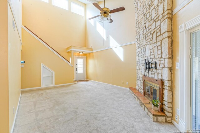 kitchen featuring ceiling fan, backsplash, a tray ceiling, sink, and black dishwasher