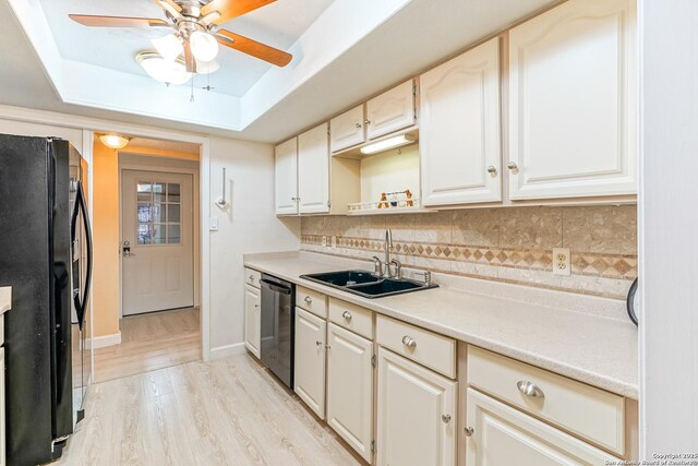 washroom featuring a textured ceiling, washing machine and dryer, and light colored carpet