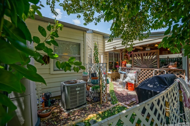 view of yard featuring central air condition unit