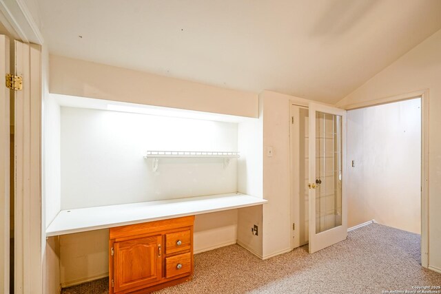 interior space featuring ceiling fan, high vaulted ceiling, beam ceiling, and light colored carpet