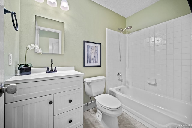 full bathroom with vanity, tile patterned floors, a textured ceiling, toilet, and tiled shower / bath combo