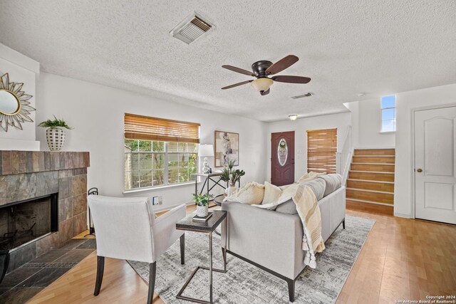 dining space with light tile patterned floors, a chandelier, french doors, and a textured ceiling