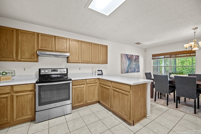 kitchen featuring decorative light fixtures, a chandelier, a textured ceiling, electric stove, and light tile patterned floors