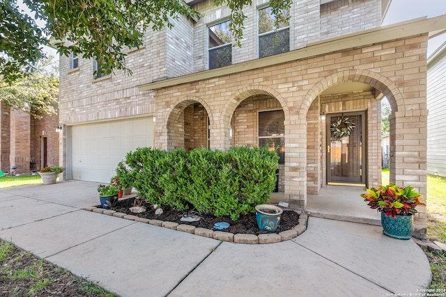 doorway to property featuring a garage