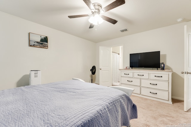 bedroom with ceiling fan and light carpet