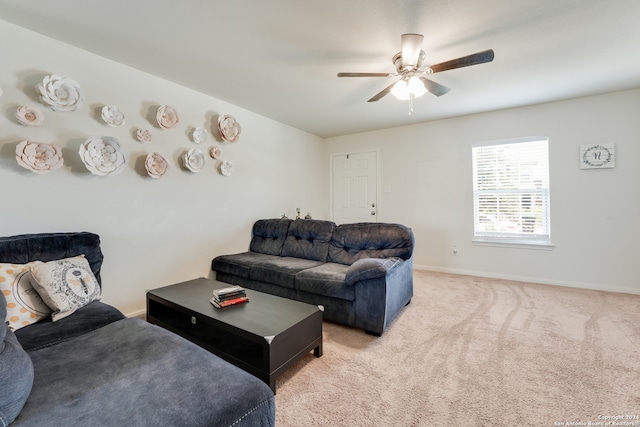 carpeted living room featuring ceiling fan