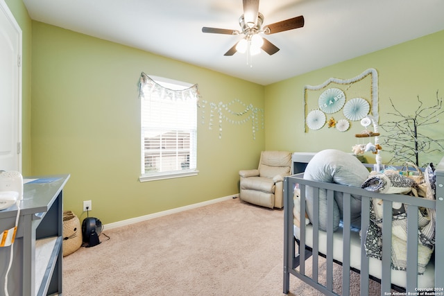 bedroom with ceiling fan and light carpet