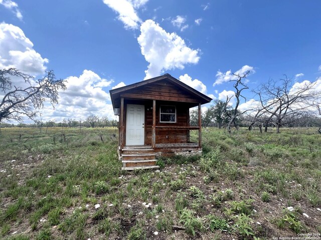 view of outbuilding featuring a rural view