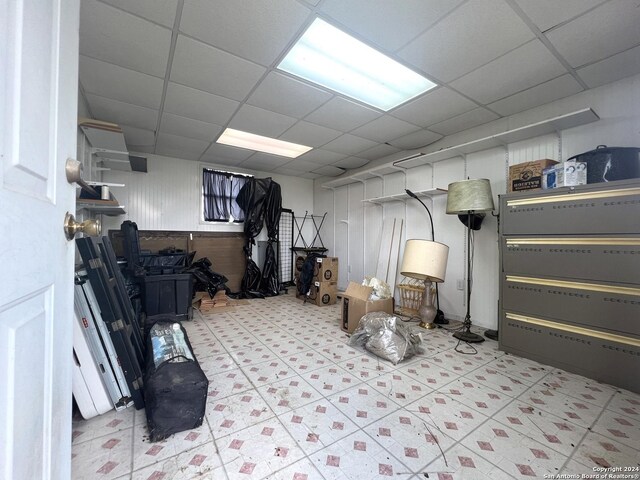 basement featuring a paneled ceiling