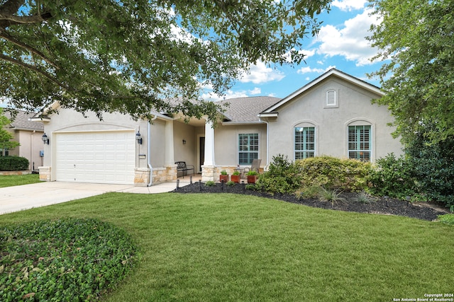 ranch-style home featuring a garage and a front lawn