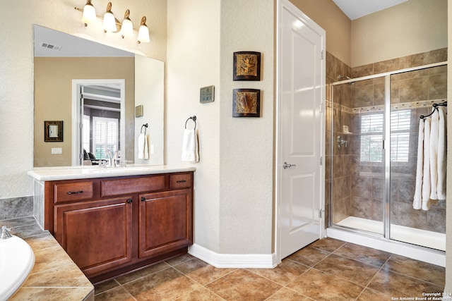 bathroom featuring separate shower and tub, vanity, and tile patterned floors