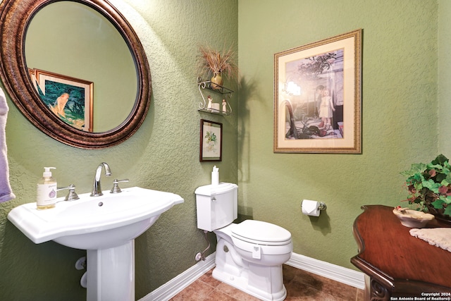 bathroom with tile patterned flooring and toilet