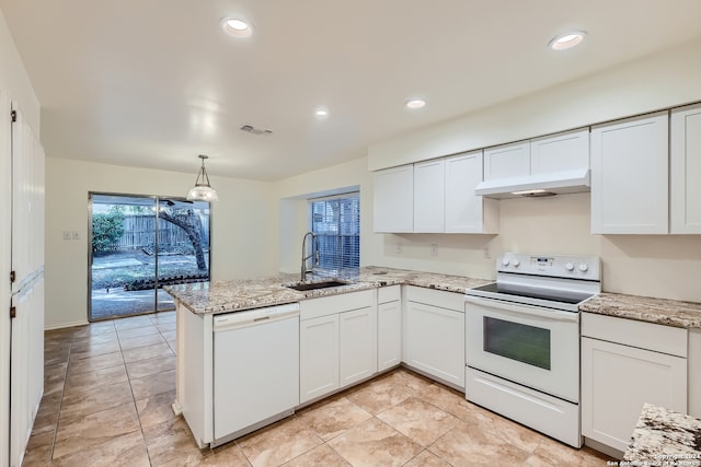 kitchen with white cabinetry, sink, kitchen peninsula, light tile patterned flooring, and white appliances