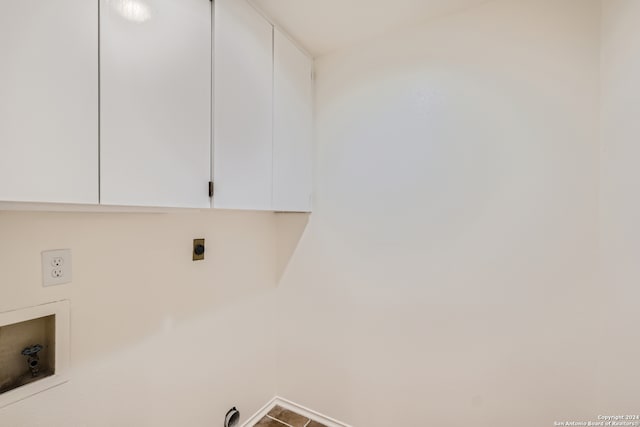 clothes washing area featuring hookup for an electric dryer, tile patterned floors, cabinets, and hookup for a washing machine