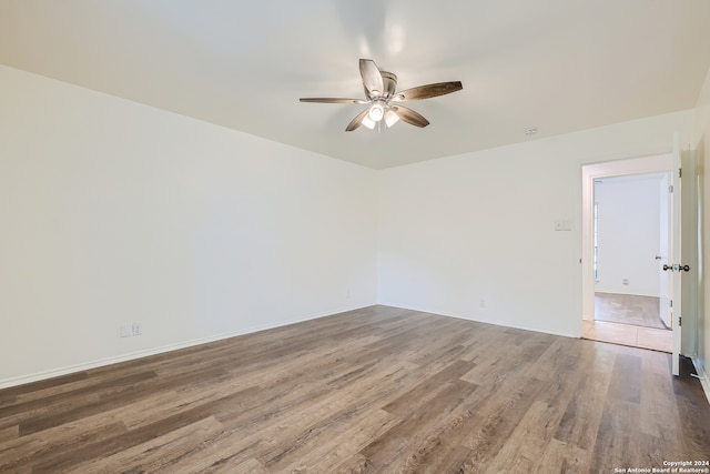 unfurnished room featuring ceiling fan and hardwood / wood-style floors