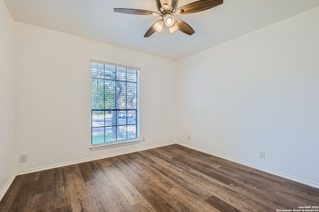 empty room with ceiling fan and hardwood / wood-style flooring