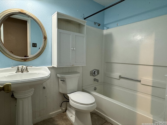 bathroom featuring shower / tub combination, tile patterned floors, and toilet