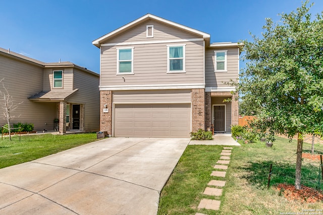 view of front of property with a garage and a front yard