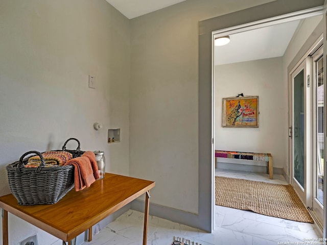 mudroom with french doors and light tile patterned floors