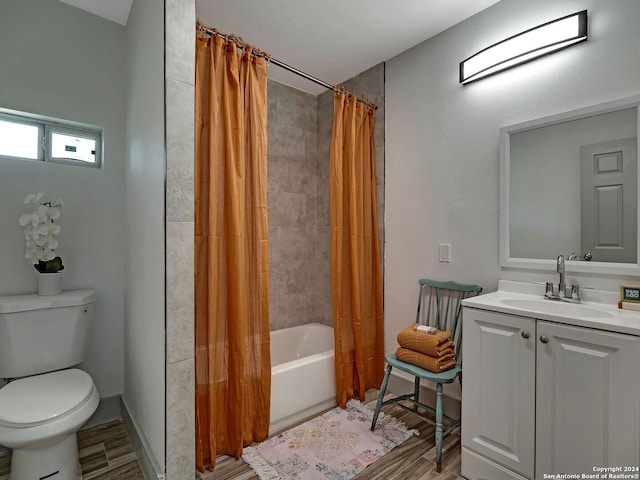 full bathroom with toilet, vanity, and shower / bathtub combination with curtain