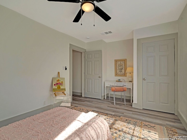 bedroom featuring ceiling fan and light hardwood / wood-style floors