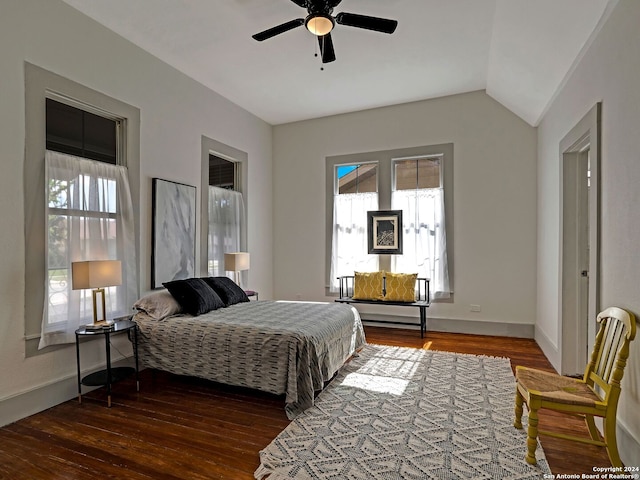 bedroom featuring ceiling fan, vaulted ceiling, and wood-type flooring