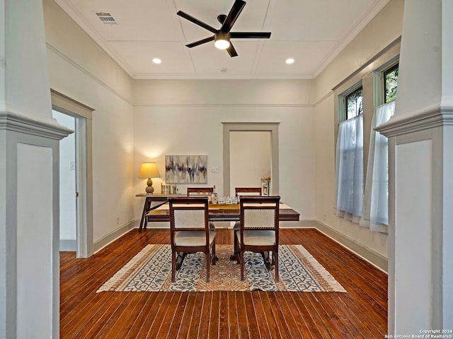 dining area with ceiling fan, dark wood-type flooring, and ornamental molding