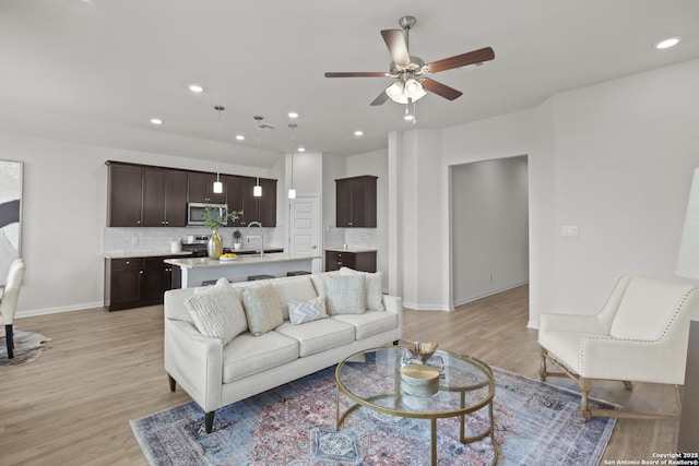 2039 Newforest Peak, New Braunfels, TX 78130 - living area featuring a ceiling fan, light wood-type flooring, baseboards, and recessed lighting