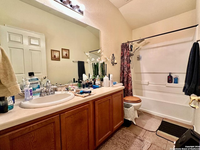 full bathroom with tile patterned floors, vanity, shower / tub combo with curtain, and toilet