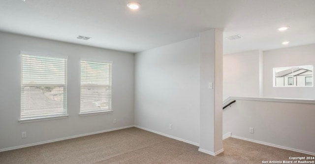 spare room featuring carpet flooring