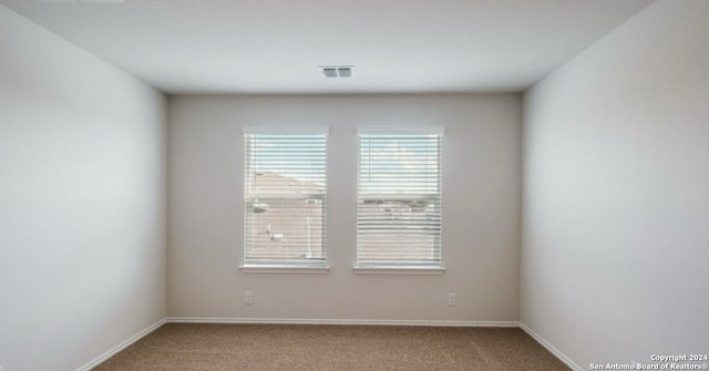 spare room featuring carpet flooring