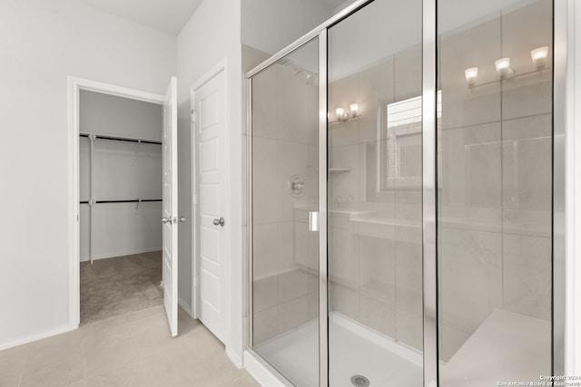 bathroom with tile patterned floors and a shower with shower door