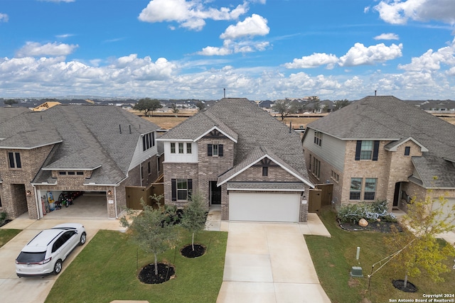 view of front of home featuring a garage and a front lawn